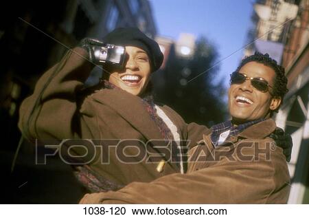 people, smiling, couple, laughing, sunglasses, outdoors, hugging View Large Photo Image Stock Image - people, smiling, couple, laughing, sunglasses, outdoors, hugging. Fotosearch