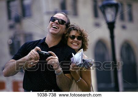 people, smiling, excited, laughing, sunglasses, Middle-aged, couples outdoors View Large Photo Image Stock Photo - people, smiling, excited, laughing, sunglasses, Middle-aged, couples outdoors. Fotosearch