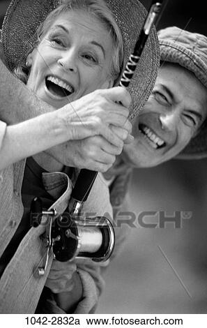 people, smiling, hat, couple, excited, senior, laughing View Large Photo Image Stock Image - people, smiling, hat, couple, excited, senior, laughing. Fotosearch
