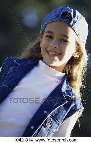 people, smiling, hat, girl, outdoors, cap, smile View Large Photo Image Picture - people, smiling, hat, girl, outdoors, cap, smile. Fotosearch