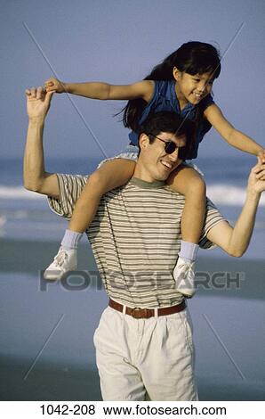 people, smiling, Hispanic, happy, beach, sunglasses, playful View Large Photo Image Stock Photo - people, smiling, Hispanic, happy, beach, sunglasses, playful. Fotosearch