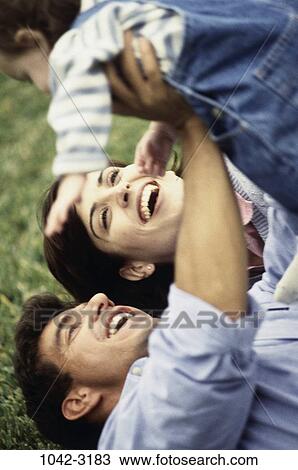 people, smiling, Hispanic, laughing, holding, outdoors, smile View Large Photo Image Stock Image - people, smiling, Hispanic, laughing, holding, outdoors, smile. Fotosearch