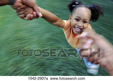 people, smiling, laughing, swinging, girl, playful, motion View Large Photo Image Stock Image - people, smiling, laughing, swinging, girl, playful, motion. Fotosearch