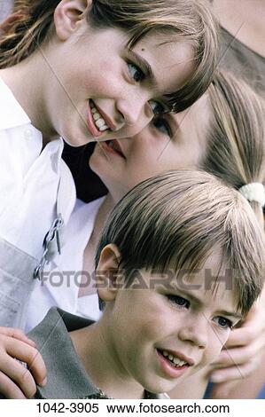 Stock Photography - people, smiling, listening, outdoors, friends, smile, children. Fotosearch