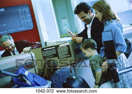 people, smiling, luggage, happy, vacations, family, traveling View Large Photo Image Stock Image - people, smiling, luggage, happy, vacations, family, traveling. Fotosearch