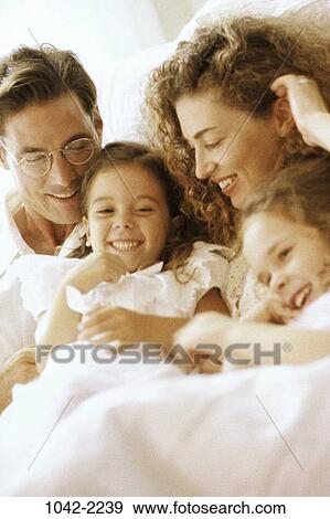 people, smiling, morning, eyeglasses, sitting, mother, Hispanic View Large Photo Image Stock Photo - people, smiling, morning, eyeglasses, sitting, mother, Hispanic. Fotosearch