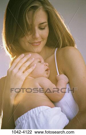 people, smiling, mother, baby, holding, newborn, smile View Large Photo Image Stock Image - people, smiling, mother, baby, holding, newborn, smile. Fotosearch