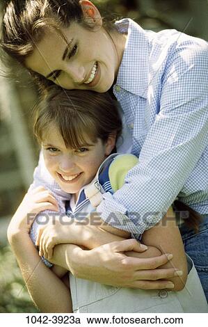 people, smiling, mother, outdoors, nurturing, hugging, family View Large Photo Image Stock Image - people, smiling, mother, outdoors, nurturing, hugging, family. Fotosearch