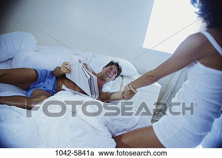 people, smiling, newspaper, couple, reading, bed View Large Photo Image Stock Image - people, smiling, newspaper, couple, reading, bed. Fotosearch