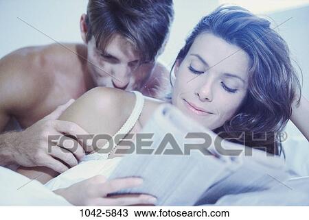 people, smiling, newspaper, couple, reading, bed View Large Photo Image Stock Image - people, smiling, newspaper, couple, reading, bed. Fotosearch