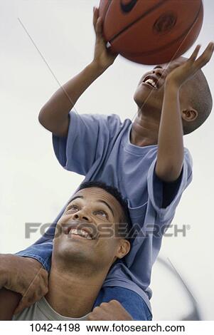 people, smiling, playing, ball, holding, carrying, smile View Large Photo Image Stock Photo - people, smiling, playing, ball, holding, carrying, smile. Fotosearch