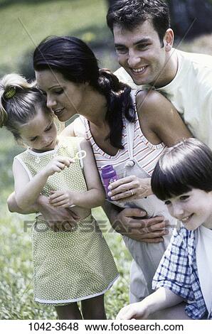 people, smiling, playing, bubbles, playful, outdoors, hugging View Large Photo Image Stock Photo - people, smiling, playing, bubbles, playful, outdoors, hugging. Fotosearch