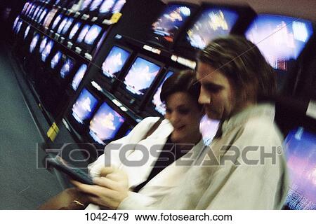 people, smiling, playing, couple, holding, looking View Large Photo Image Stock Photo - people, smiling, playing, couple, holding, looking. Fotosearch