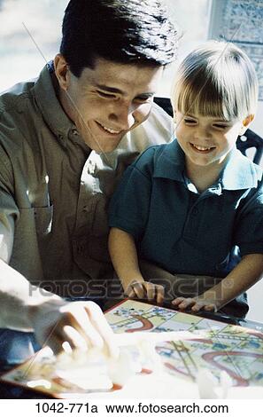 people, smiling, playing, games, family, affection View Large Photo Image Stock Image - people, smiling, playing, games, family, affection. Fotosearch