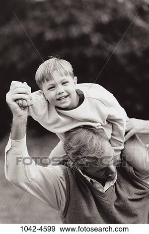 Stock Photo - people, smiling, playing, outdoors, carrying, smile. Fotosearch