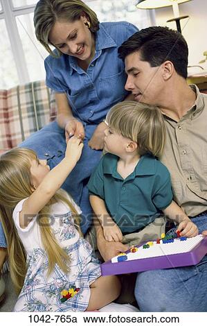 people, smiling, playing, sitting, mother, sofa, leaning View Large Photo Image Stock Image - people, smiling, playing, sitting, mother, sofa, leaning. Fotosearch