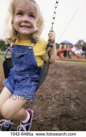 people, smiling, playing, swinging, girl, swing, playground View Large Photo Image Stock Image - people, smiling, playing, swinging, girl, swing, playground. Fotosearch