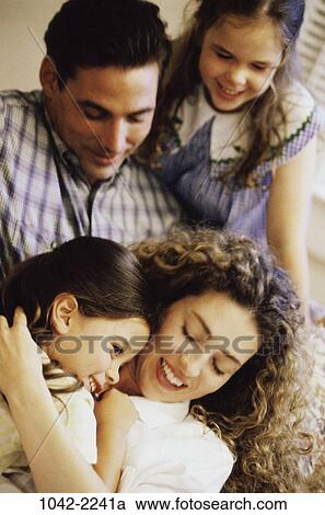 people, smiling, sitting, mother, Hispanic, holding, standing View Large Photo Image Stock Image - people, smiling, sitting, mother, Hispanic, holding, standing. Fotosearch