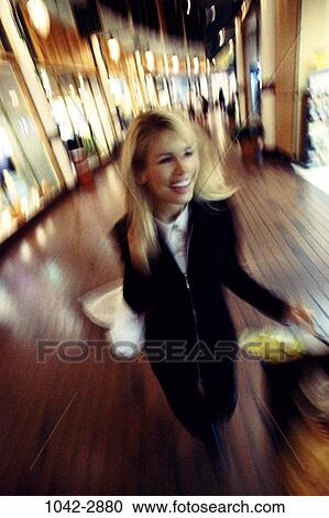 people, smiling, suit, sunlight, floor, hair, women indoors View Large Photo Image Stock Image - people, smiling, suit, sunlight, floor, hair, women indoors. Fotosearch