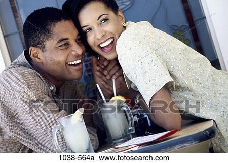 people, smiling, table, couple, dress, cafe, outdoors View Large Photo Image Stock Image - people, smiling, table, couple, dress, cafe, outdoors. Fotosearch