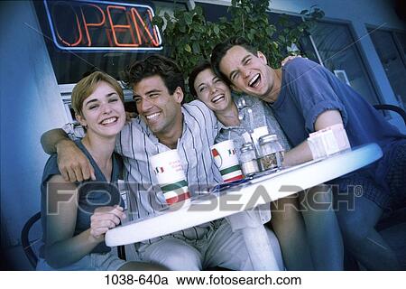 people, smiling, table, laughing, cafe, outdoors View Large Photo Image Stock Image - people, smiling, table, laughing, cafe, outdoors. Fotosearch