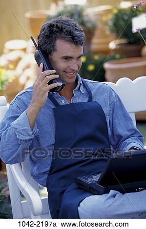 people, smiling, telephone, talking, sitting, computer View Large Photo Image Stock Image - people, smiling, telephone, talking, sitting, computer. Fotosearch