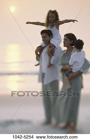 people, sunset, beach, tranquility, family, vacation, tranquil View Large Photo Image Picture - people, sunset, beach, tranquility, family, vacation, tranquil. Fotosearch