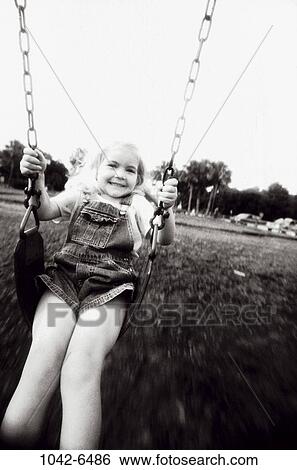people, swinging, girl, swing, outdoors, child, fun View Large Photo Image Stock Photograph - people, swinging, girl, swing, outdoors, child, fun. Fotosearch