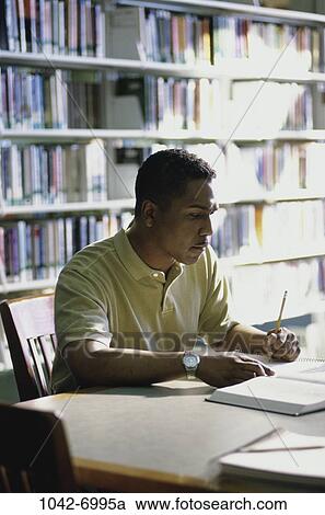 people, table, chair, pencil, books, reading View Large Photo Image Stock Image - people, table, chair, pencil, books, reading. Fotosearch