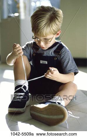 Stock Image - people, tie, shoes, boy, achievement, contemplation, contemplating. Fotosearch