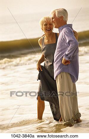 people, wading, walking, couple, senior, beach, laughing View Large Photo Image Stock Image - people, wading, walking, couple, senior, beach, laughing. Fotosearch