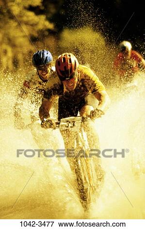 people, water, racing, helmet, mud, outdoors View Large Photo Image Stock Photo - people, water, racing, helmet, mud, outdoors. Fotosearch