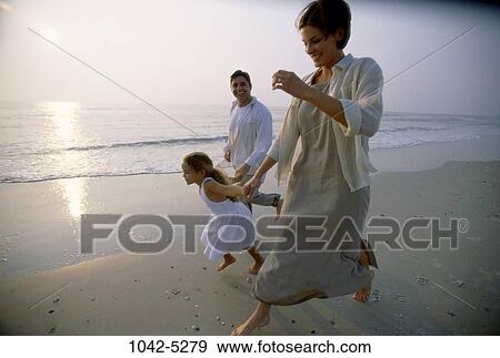 people, water, running, smiling, beach, pulling, shore View Large Photo Image Stock Photo - people, water, running, smiling, beach, pulling, shore. Fotosearch