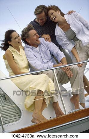 people, windy, wind, laughing, boating, outdoors, boat View Large Photo Image Stock Image - people, windy, wind, laughing, boating, outdoors, boat. Fotosearch