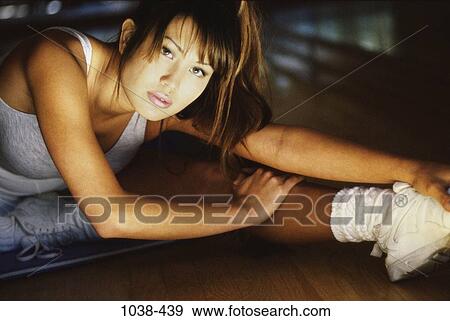 people, woman, Asian, stretching, exercise, exercising, indoors View Large Photo Image Stock Photo - people, woman, Asian, stretching, exercise, exercising, indoors. Fotosearch