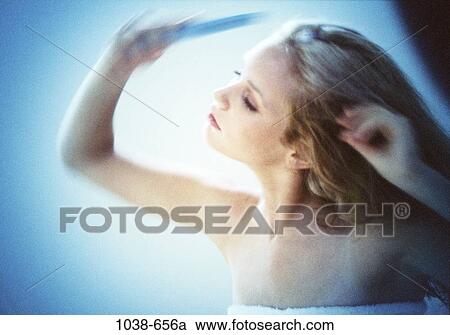Stock Image - people, woman, hair, brushing, blond, bath, brush. Fotosearch