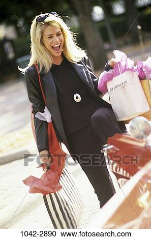people, woman, laughing, outdoors, shopping, blond View Large Photo Image Stock Image - people, woman, laughing, outdoors, shopping, blond. Fotosearch
