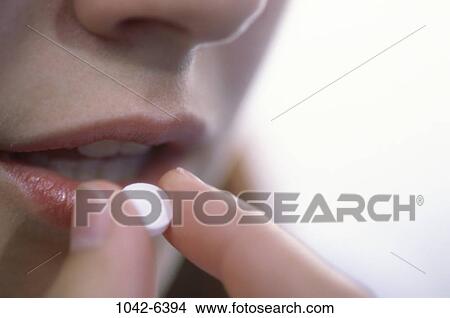 people, woman, pill, mouth, medicine, Middle-aged, pain View Large Photo Image Picture - people, woman, pill, mouth, medicine, Middle-aged, pain. Fotosearch