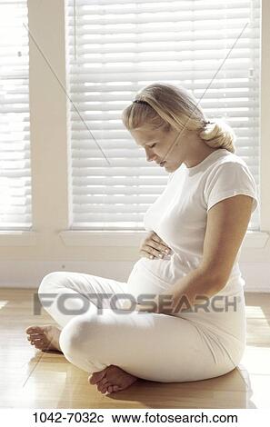 Stock Image - people, woman, pregnancy, young adult, Young women pregnant. Fotosearch