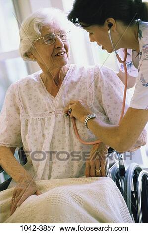 people, woman, senior, patient, nurse, nursing home, concern View Large Photo Image Stock Photo - people, woman, senior, patient, nurse, nursing home, concern. Fotosearch
