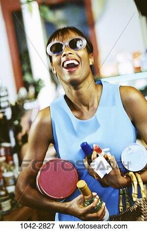 people, woman, smiling, bottle, laughing, bracelet, hair View Large Photo Image Stock Photo - people, woman, smiling, bottle, laughing, bracelet, hair. Fotosearch