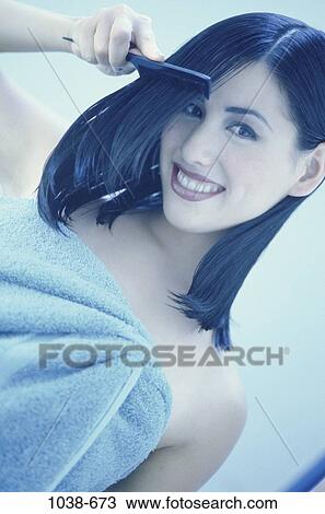 Stock Image - people, woman, smiling, Hispanic, hair, looking, towel. Fotosearch