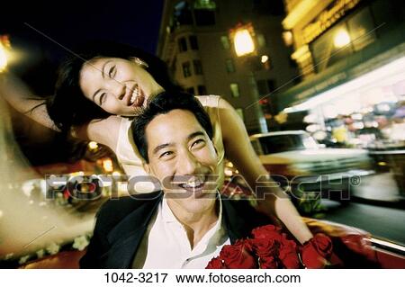 red, people, blur, smiling, night, Asian, couple View Large Photo Image Stock Photo - red, people, blur, smiling, night, Asian, couple. Fotosearch