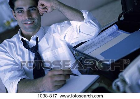 relaxed, hotel, pen, paper, desk, smiling View Large Photo Image Stock Photo - relaxed, hotel, pen, paper, desk, smiling. Fotosearch