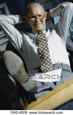 relaxed, paper, desk, sitting, senior, happy View Large Photo Image Stock Photo - relaxed, paper, desk, sitting, senior, happy. Fotosearch