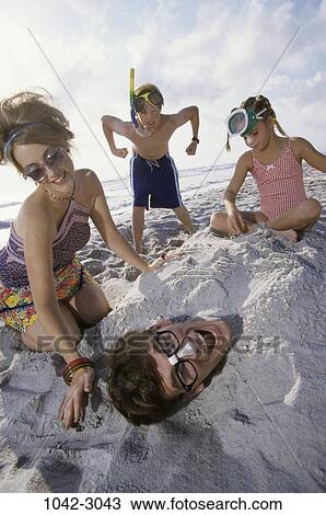 sand, people, beach, family, humor, covered, screaming View Large Photo Image Stock Image - sand, people, beach, family, humor, covered, screaming. Fotosearch