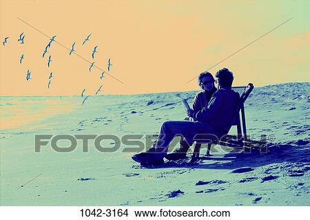 sand, people, birds, couple, beach, sunglasses, Middle-aged View Large Photo Image Picture - sand, people, birds, couple, beach, sunglasses, Middle-aged. Fotosearch