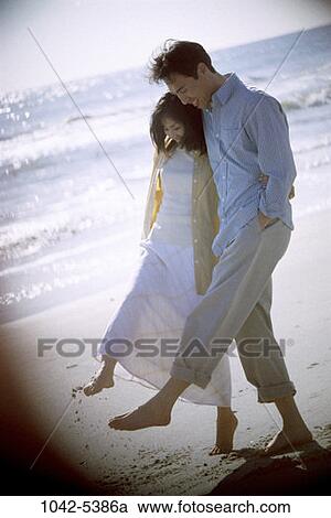 sand, people, water, playing, walking, Asian, couple View Large Photo Image Stock Image - sand, people, water, playing, walking, Asian, couple. Fotosearch