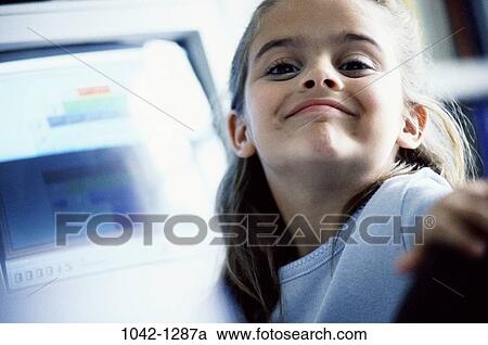 smiling, excited, sitting, computer, girl, child, proud View Large Photo Image Stock Image - smiling, excited, sitting, computer, girl, child, proud. Fotosearch