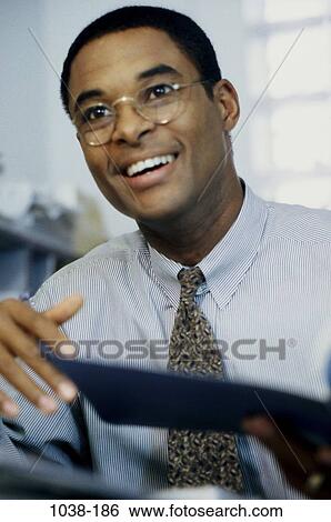 Stock Photograph - smiling, eyeglasses, happy, individual, business, Middle-aged. Fotosearch